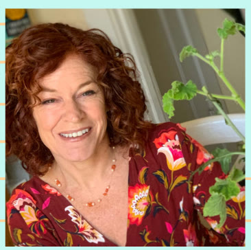 Maria Scatina, teacher and owner of Pickles Preschool, smiling indoors beside a houseplant.